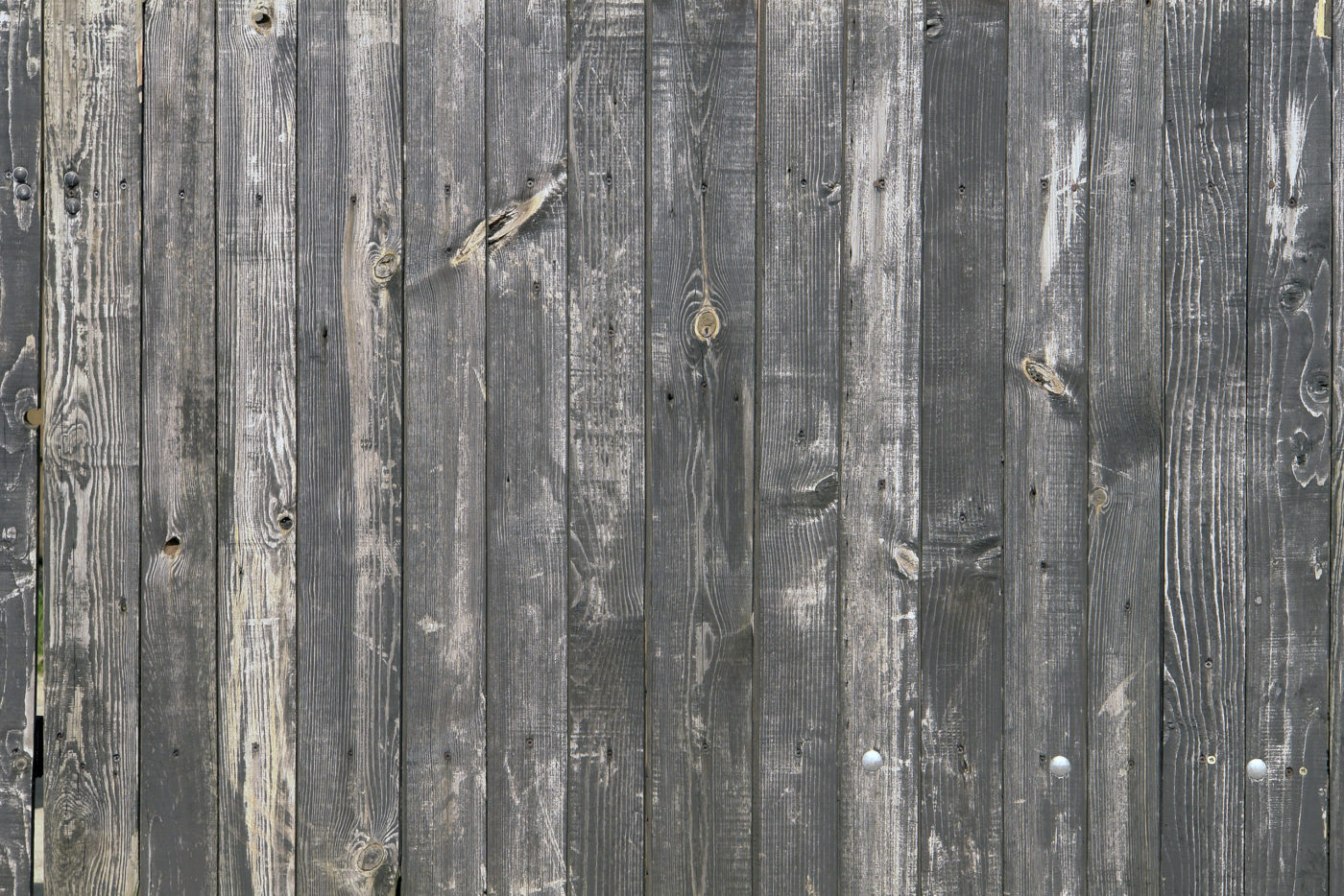 An image of an older weathered wooden fence.